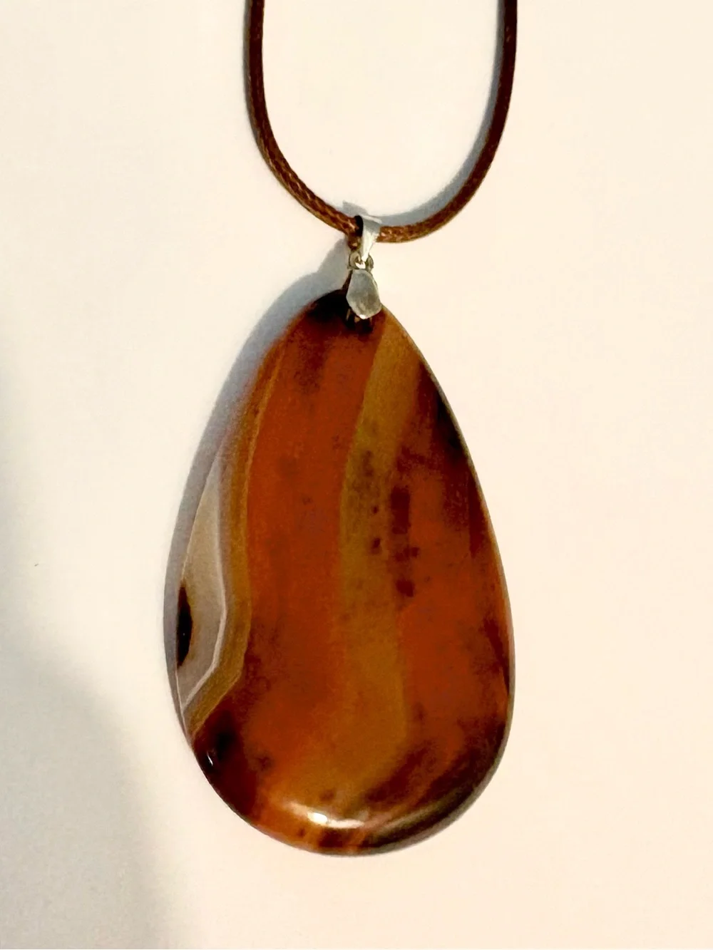 Beautiful, Geode Agate, pendant on a brown leather cord.